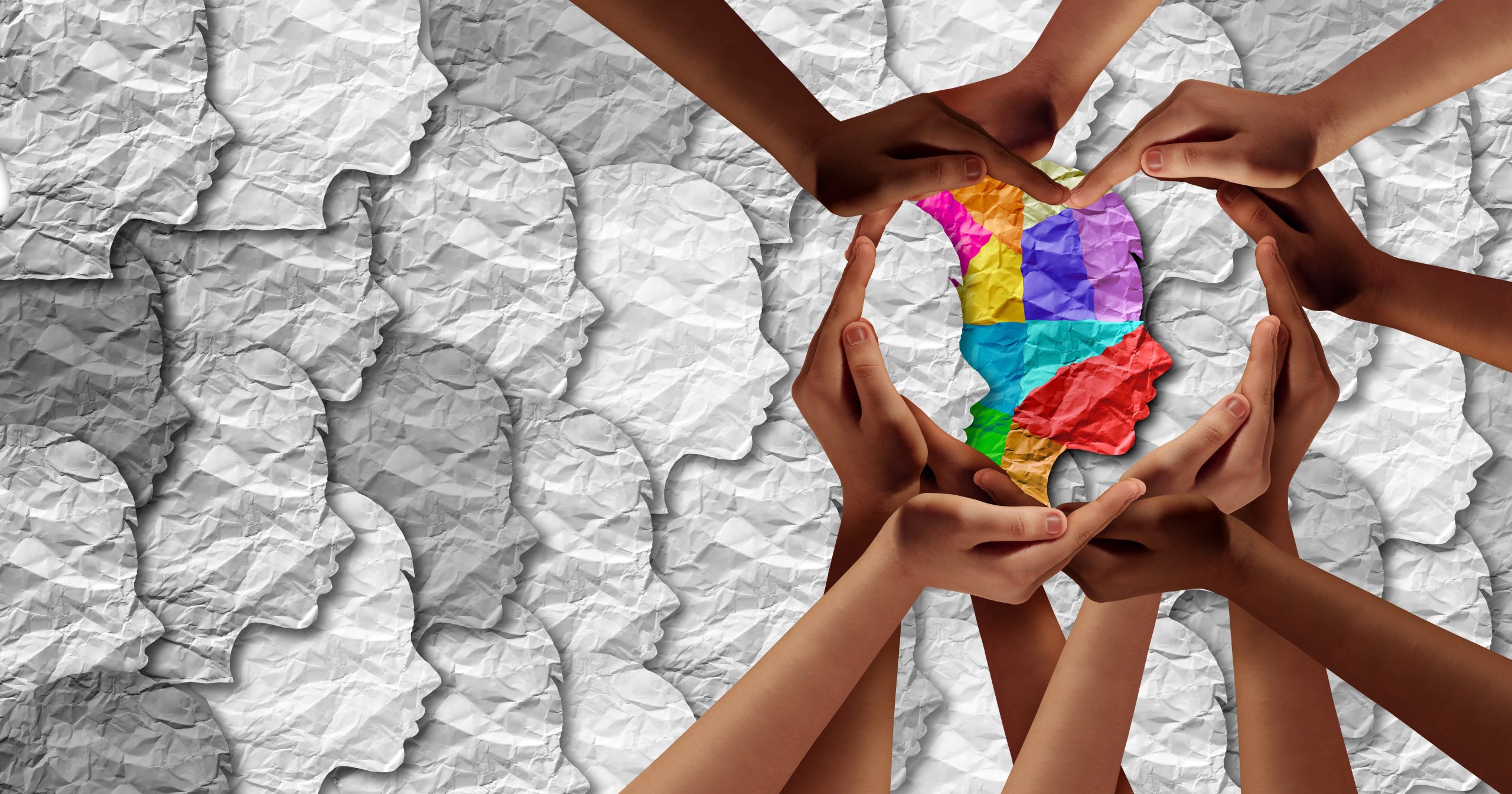 Hands forming a heart around a symbol of autism resources in Berks Count